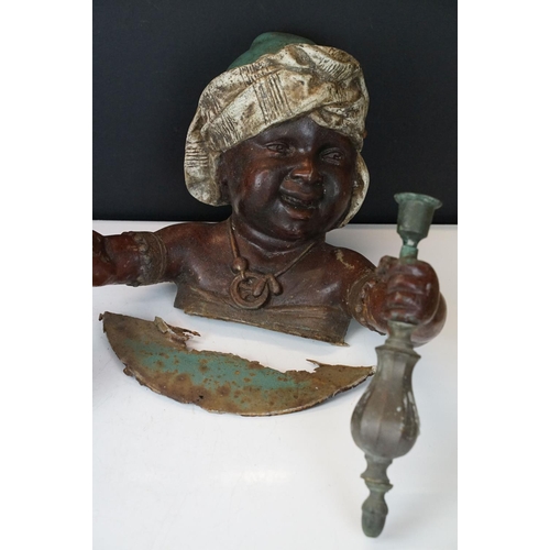 173 - Pair of 19th Century cast metal figural wall sconces in the form of African children, each holding a... 