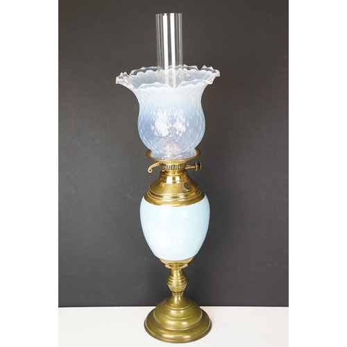 174 - Early 20th Century oil lamp having a round stepped brass base with blue ceramic reservoir and opalin... 