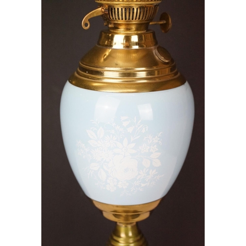 174 - Early 20th Century oil lamp having a round stepped brass base with blue ceramic reservoir and opalin... 