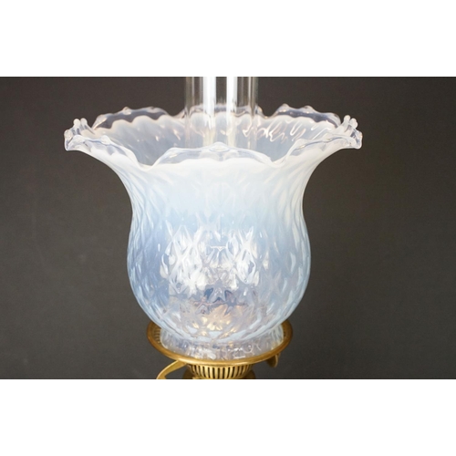 174 - Early 20th Century oil lamp having a round stepped brass base with blue ceramic reservoir and opalin... 