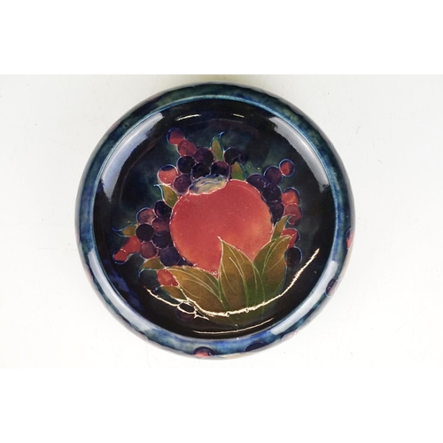 2 - Moorcroft pottery pomegranate pattern round dish having a blue ground with incised and painted detai... 