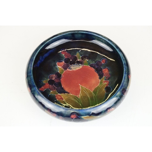 2 - Moorcroft pottery pomegranate pattern round dish having a blue ground with incised and painted detai... 