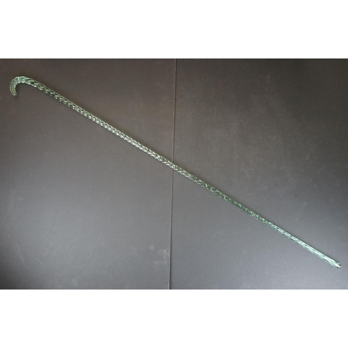 22 - 19th Century Nailsea green glass walking cane of spiralling twisted form, approx 116cm long