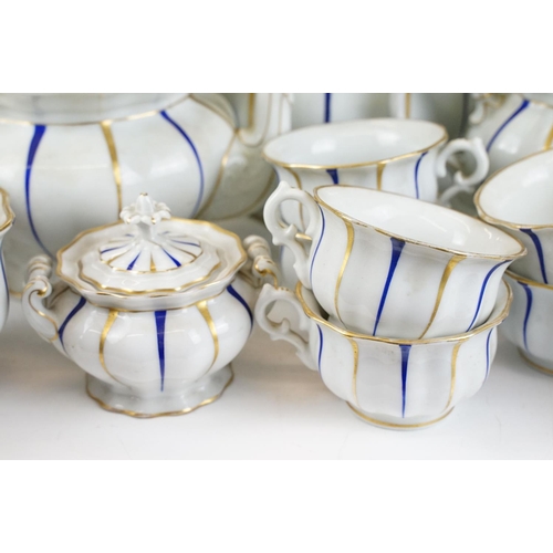 25 - Early 20th Century Furstenberg porcelain tea set of scalloped form, decorated with blue & gilt strip... 