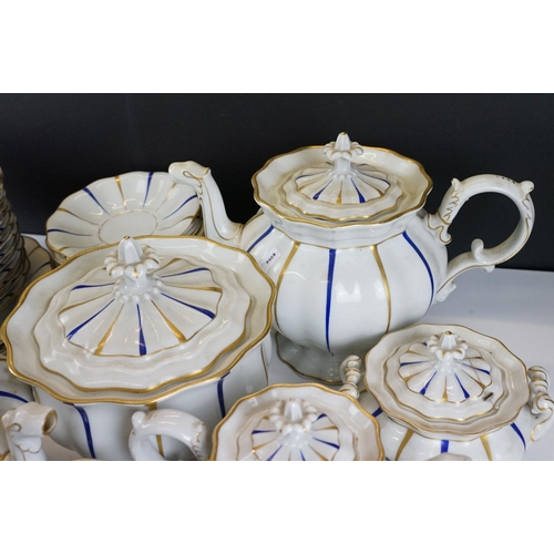 25 - Early 20th Century Furstenberg porcelain tea set of scalloped form, decorated with blue & gilt strip... 