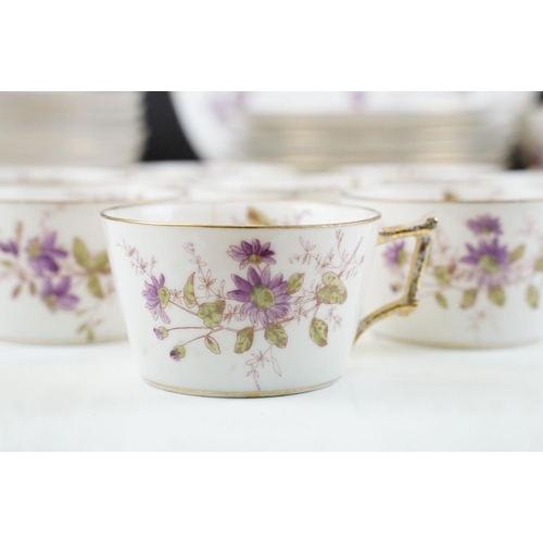 32 - G.D. & Cie Limoges floral tea set with gilt details, pattern no. 959, to include 9 teacups & saucers... 