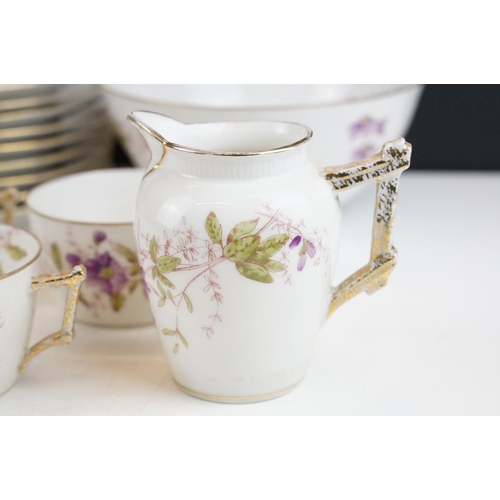 32 - G.D. & Cie Limoges floral tea set with gilt details, pattern no. 959, to include 9 teacups & saucers... 