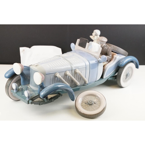 34 - Large Lladro ' High Speed ' porcelain model, no. 1779, with driver & female passenger, measures appr... 