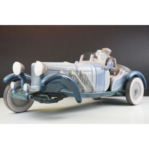 34 - Large Lladro ' High Speed ' porcelain model, no. 1779, with driver & female passenger, measures appr... 