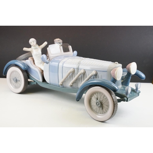 34 - Large Lladro ' High Speed ' porcelain model, no. 1779, with driver & female passenger, measures appr... 