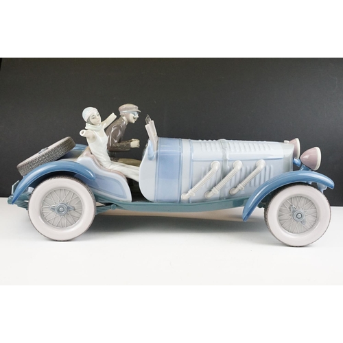 34 - Large Lladro ' High Speed ' porcelain model, no. 1779, with driver & female passenger, measures appr... 