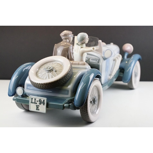 34 - Large Lladro ' High Speed ' porcelain model, no. 1779, with driver & female passenger, measures appr... 