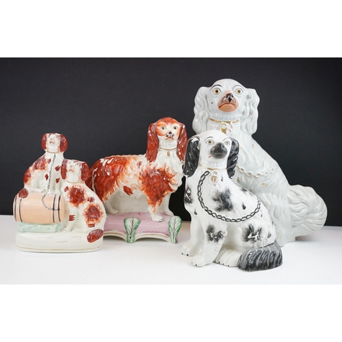 35 - Group of four 19th century Staffordshire flatback mantel dog figures with painted details, featuring... 