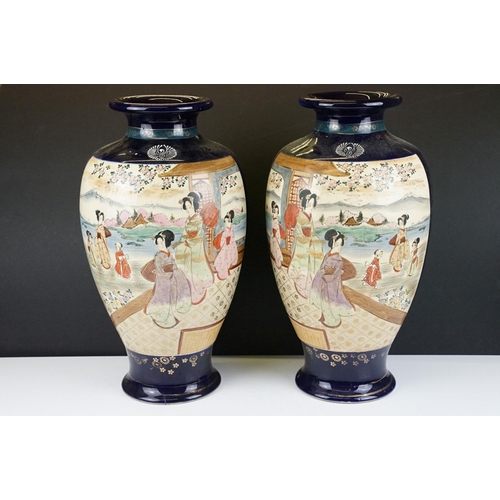 36 - Large pair of Oriental cobalt blue ground baluster vases, with figural panels of females with mounta... 