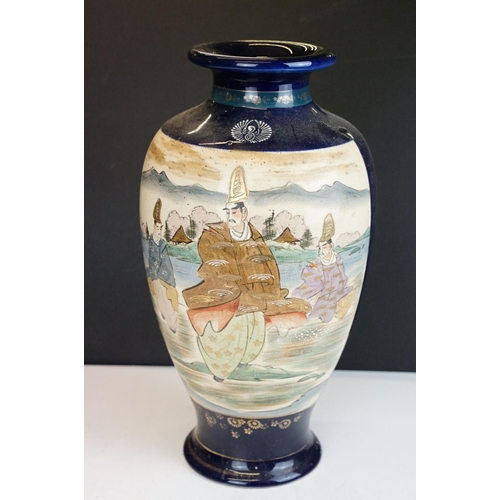 36 - Large pair of Oriental cobalt blue ground baluster vases, with figural panels of females with mounta... 