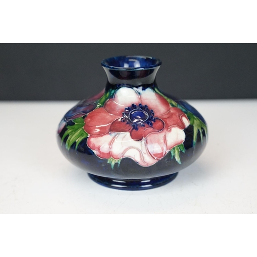 54 - William Moorcroft 'Anemone' pattern squat vase on cobalt blue ground, signed to base, impressed 'Pot... 