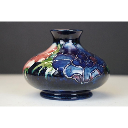 54 - William Moorcroft 'Anemone' pattern squat vase on cobalt blue ground, signed to base, impressed 'Pot... 