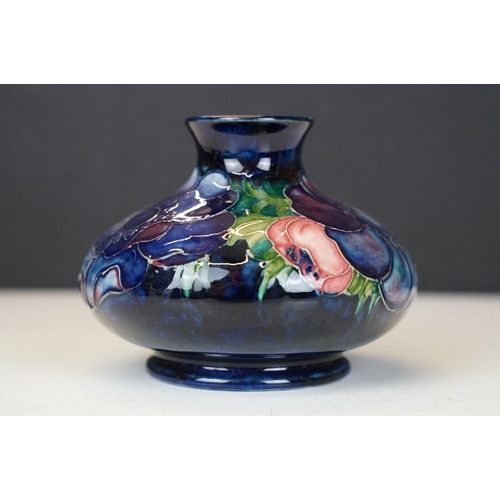 54 - William Moorcroft 'Anemone' pattern squat vase on cobalt blue ground, signed to base, impressed 'Pot... 