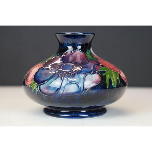 54 - William Moorcroft 'Anemone' pattern squat vase on cobalt blue ground, signed to base, impressed 'Pot... 