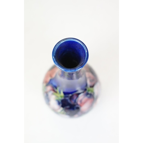 55 - Moorcroft Pottery 'Anemone' pattern vase of bulbous form, on cobalt blue ground, impressed marks to ... 