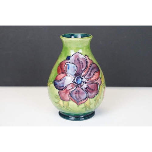 56 - Moorcroft Pottery 'Anemone' pattern green ground baluster vase, impressed marks to base, date code f... 