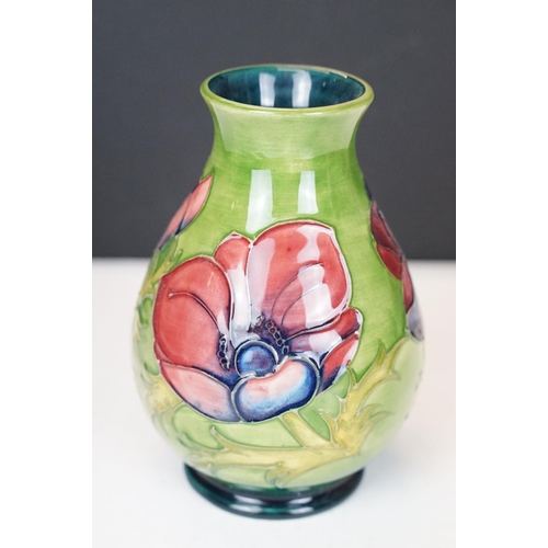 56 - Moorcroft Pottery 'Anemone' pattern green ground baluster vase, impressed marks to base, date code f... 