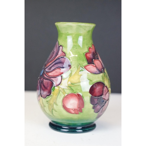 56 - Moorcroft Pottery 'Anemone' pattern green ground baluster vase, impressed marks to base, date code f... 