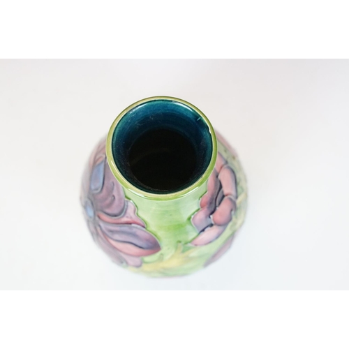 56 - Moorcroft Pottery 'Anemone' pattern green ground baluster vase, impressed marks to base, date code f... 