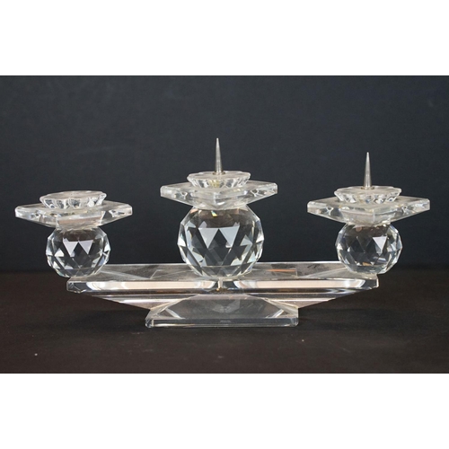 58 - Swarovski crystal three-light candelabrum (18.5cm wide), together with a matching candle holder, and... 