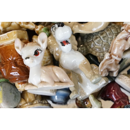 67 - Collection of around 50 Wade ceramic figures, mostly Wade Whimsies, also featuring Disney examples, ... 