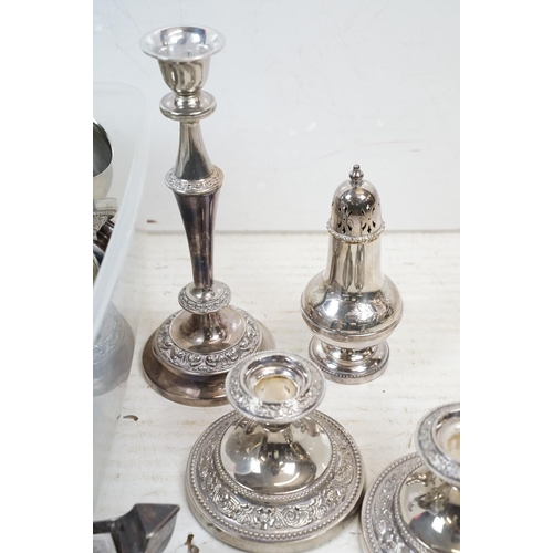 355 - A collection of mixed silver plate to include toast rack, candlesticks, sugar shaker, salts....etc..