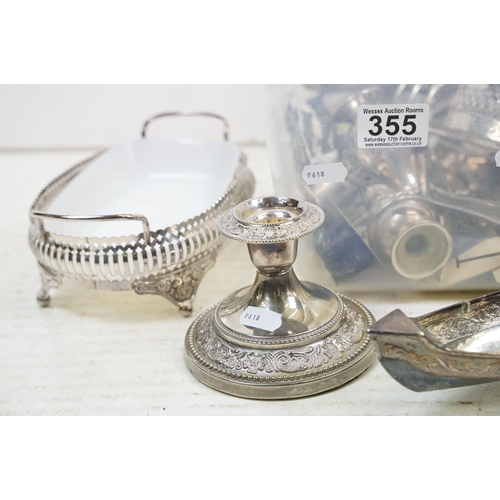 355 - A collection of mixed silver plate to include toast rack, candlesticks, sugar shaker, salts....etc..