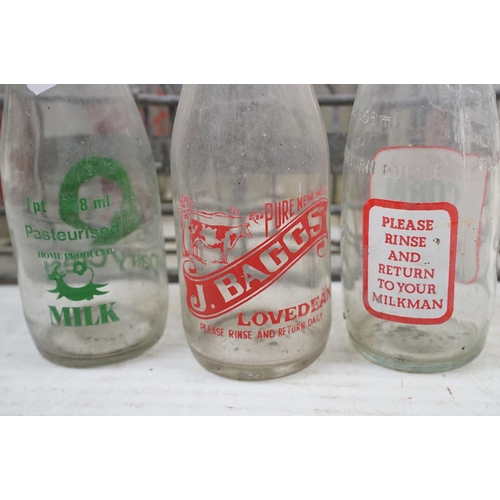 363 - Collection of 20 glass milk bottles with dairy advertising, housed within a metal crate (approx 47cm... 