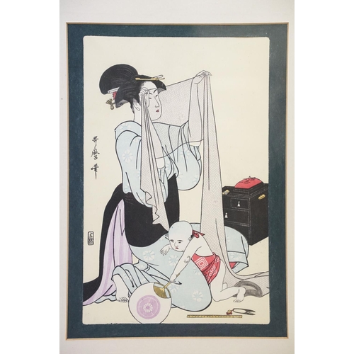 485 - Kitagawa Utamaro - A pair of framed Japanese woodblock prints including Geishas on a bridge and a mo... 