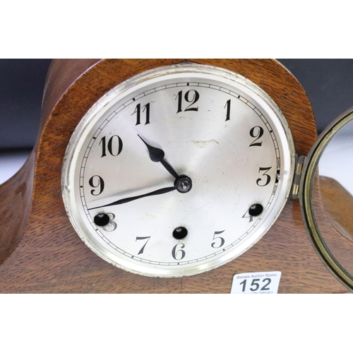 152 - Two early 20th Century mantle clock to include an oak cased Napoleons hat clock and a Smiths mahogan... 