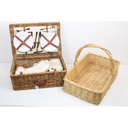 154 - Wicker basket appointed with picnic set having plates, knives and forks, cork screw, wine glasses, l... 