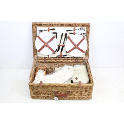 154 - Wicker basket appointed with picnic set having plates, knives and forks, cork screw, wine glasses, l... 