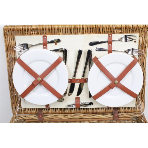 154 - Wicker basket appointed with picnic set having plates, knives and forks, cork screw, wine glasses, l... 