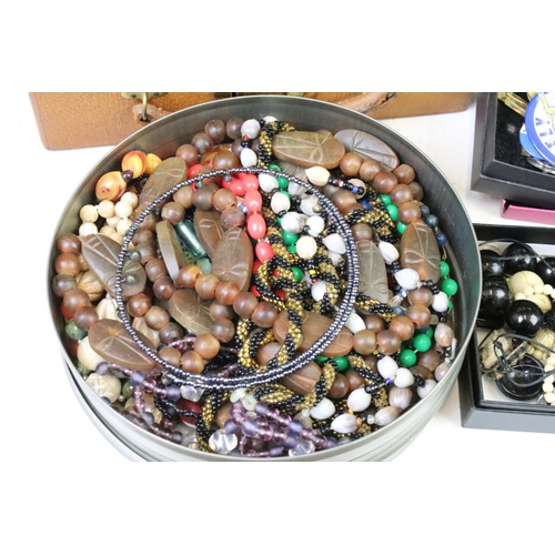 302 - A collection of mixed vintage and contemporary costume jewellery to include silver examples together... 