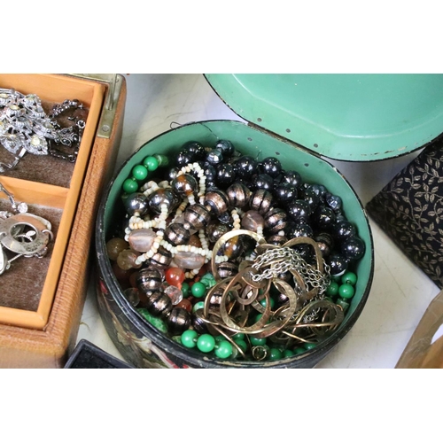 302 - A collection of mixed vintage and contemporary costume jewellery to include silver examples together... 