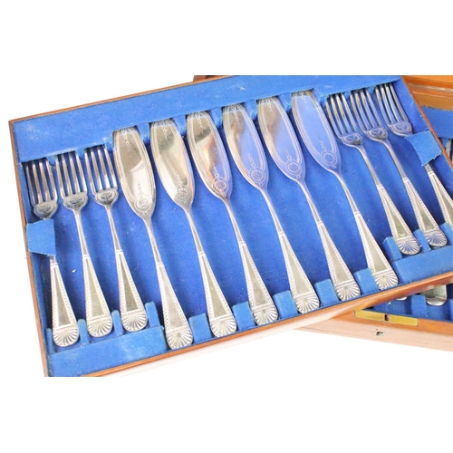 308 - A canteen of silver plated cutlery together with fish knives and forks with mother of pearl handles.