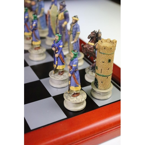 310 - A contemporary 'The Chessmen' hand painted chess set.