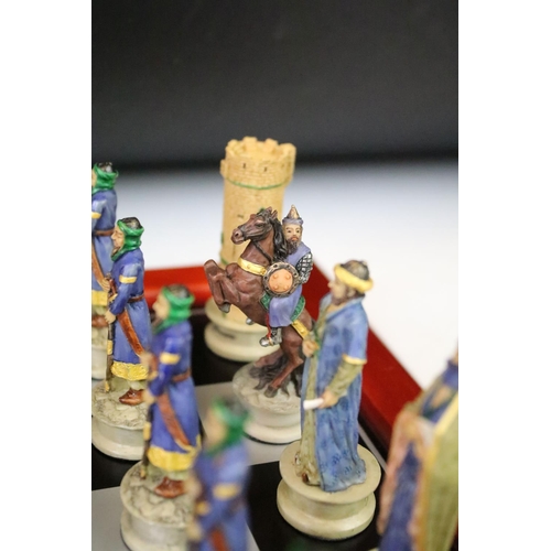 310 - A contemporary 'The Chessmen' hand painted chess set.