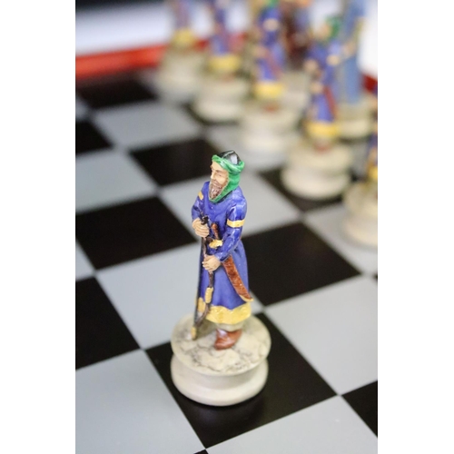 310 - A contemporary 'The Chessmen' hand painted chess set.