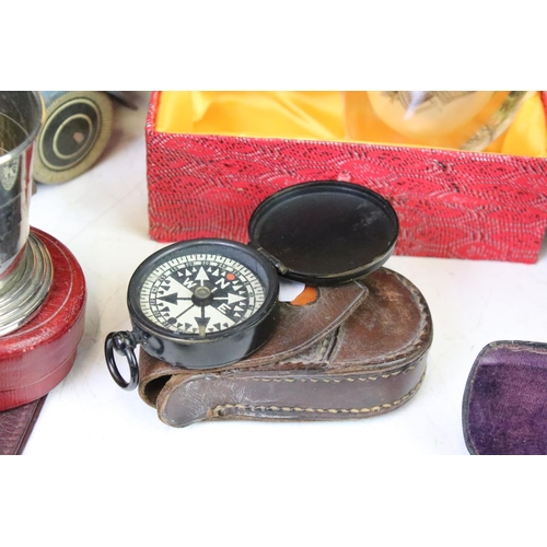 317 - A group of mixed collectables to include tin plate toy car, purses, compasses, snuff bottle ....etc.