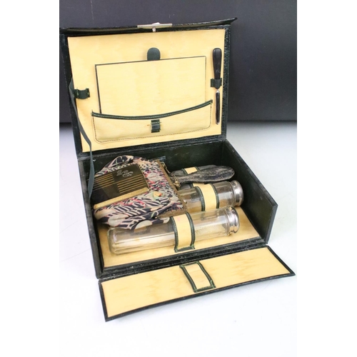 319 - A vintage travelling vanity case complete with contents together with a selection of hallmarked ster... 