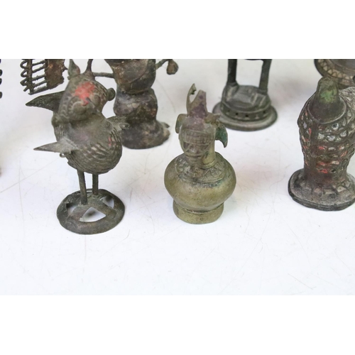 294 - A collection of cast metal Indian ornamental figures to include religious examples.