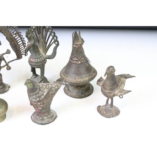 294 - A collection of cast metal Indian ornamental figures to include religious examples.