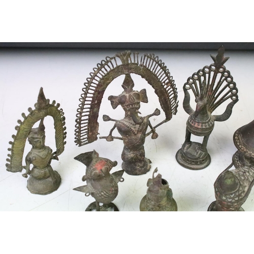 294 - A collection of cast metal Indian ornamental figures to include religious examples.