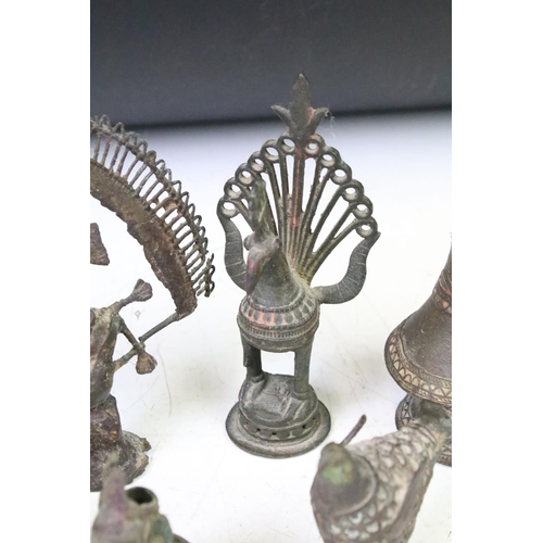 294 - A collection of cast metal Indian ornamental figures to include religious examples.